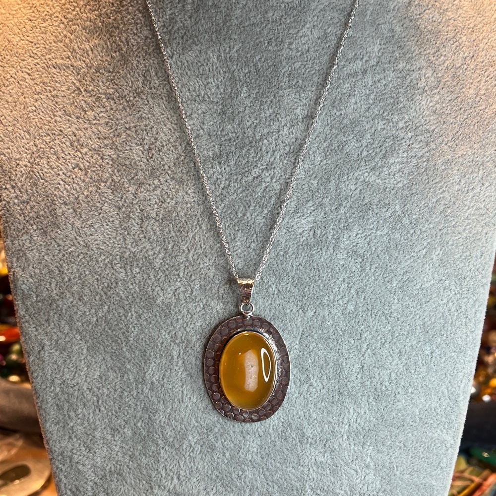 Elegant Silver Necklace with golden healer Pendant